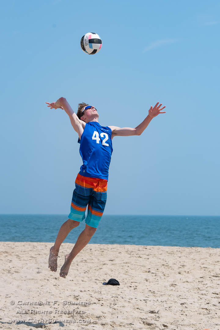Beach Volleyball - Young Man Jump Serving: Rehobeth Beach, Delaware