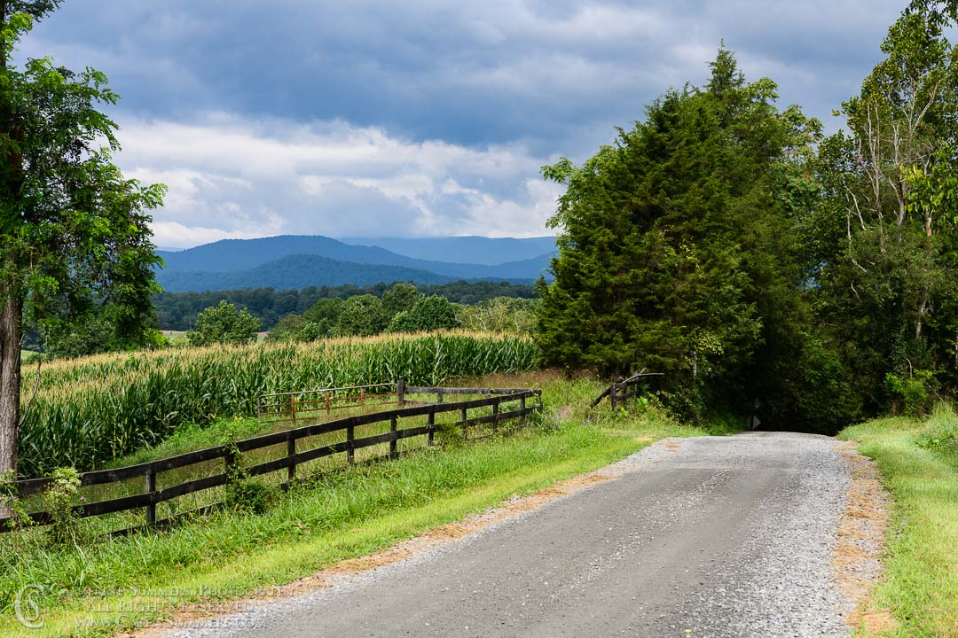 20180822_001: clouds, horizontal, fence, summer, Blue Ridge Mountains, gravel road, corn field