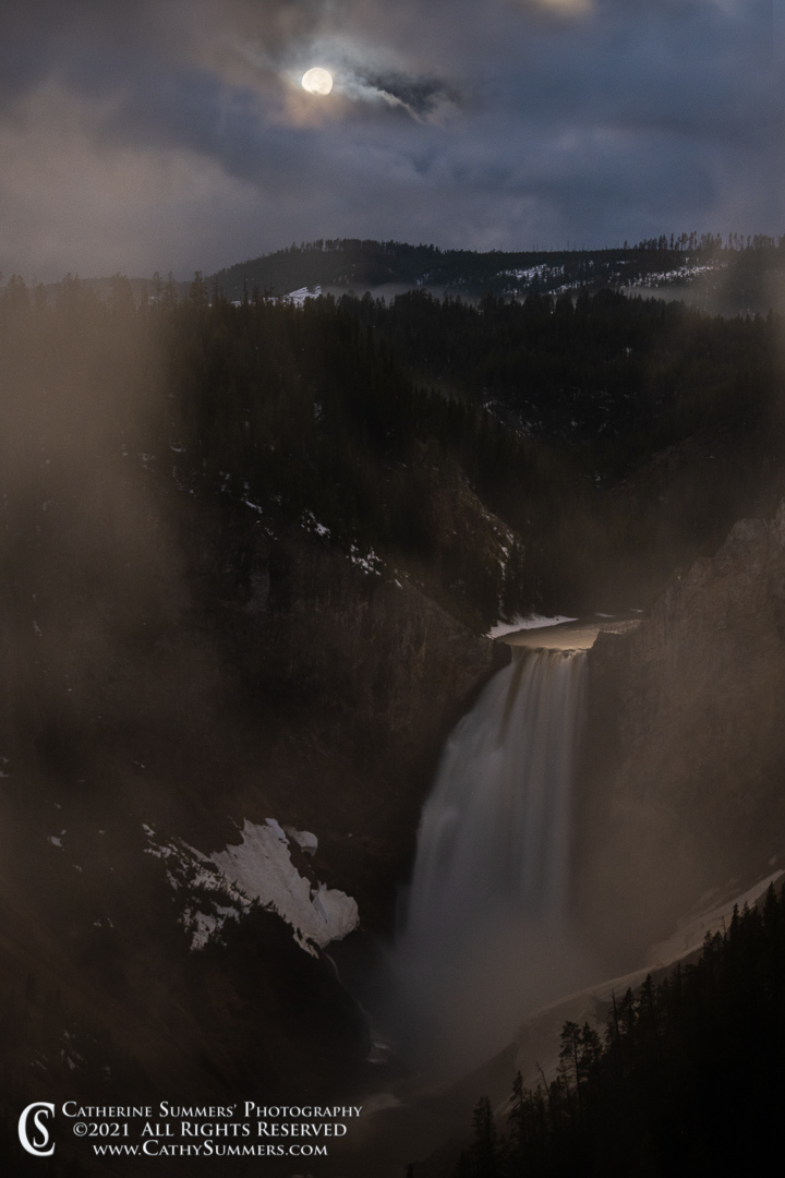 Full Moon in the Clouds Over Lower Falls of the Yellowstone Rive in Yellowstone National Park - Composite image.