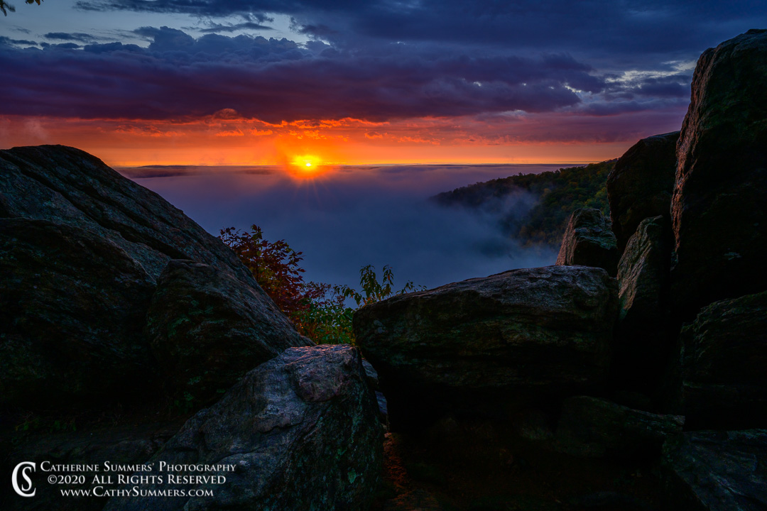 The Sun Rises Between the Clouds on an Early Autumn Morning in the Blue Ridge Mountains