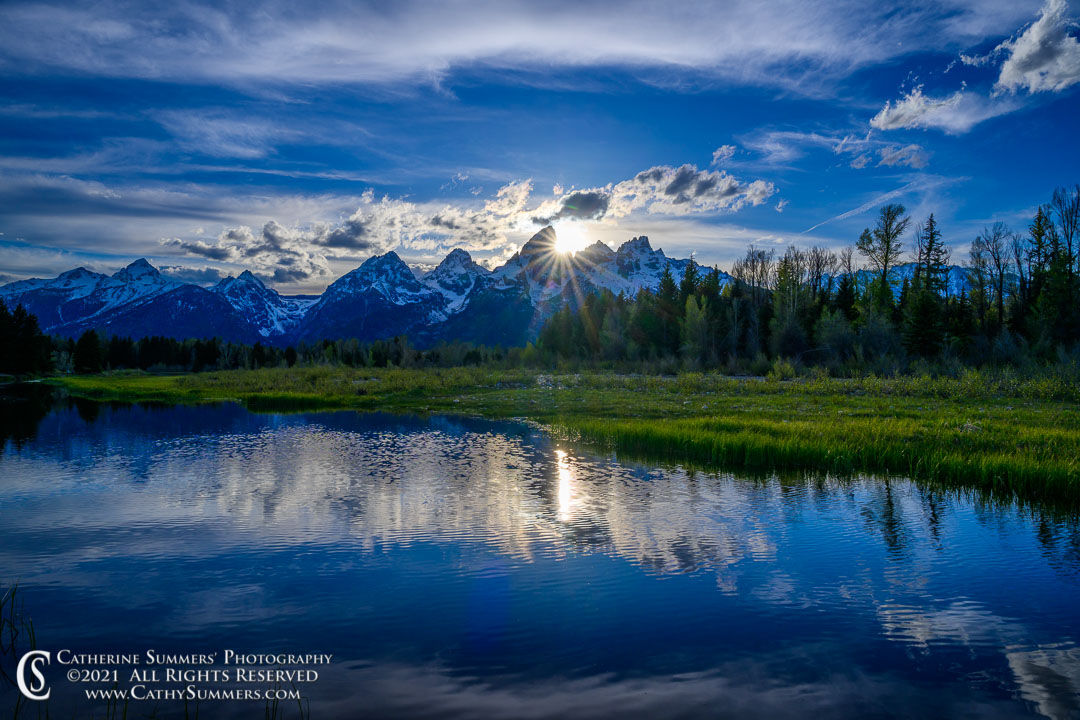 Sun Setting Behind the Grand Teton with Reflections at Schwabacher Landing