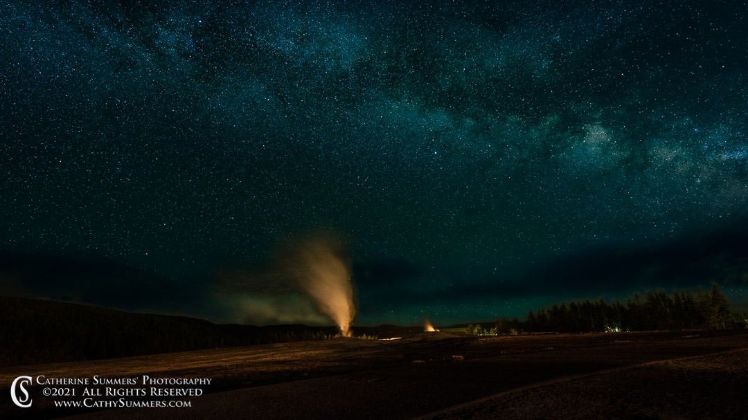 Milky Way (and clouds) Over Old Faithful on an Early Summer Night in Yellowstone National Park