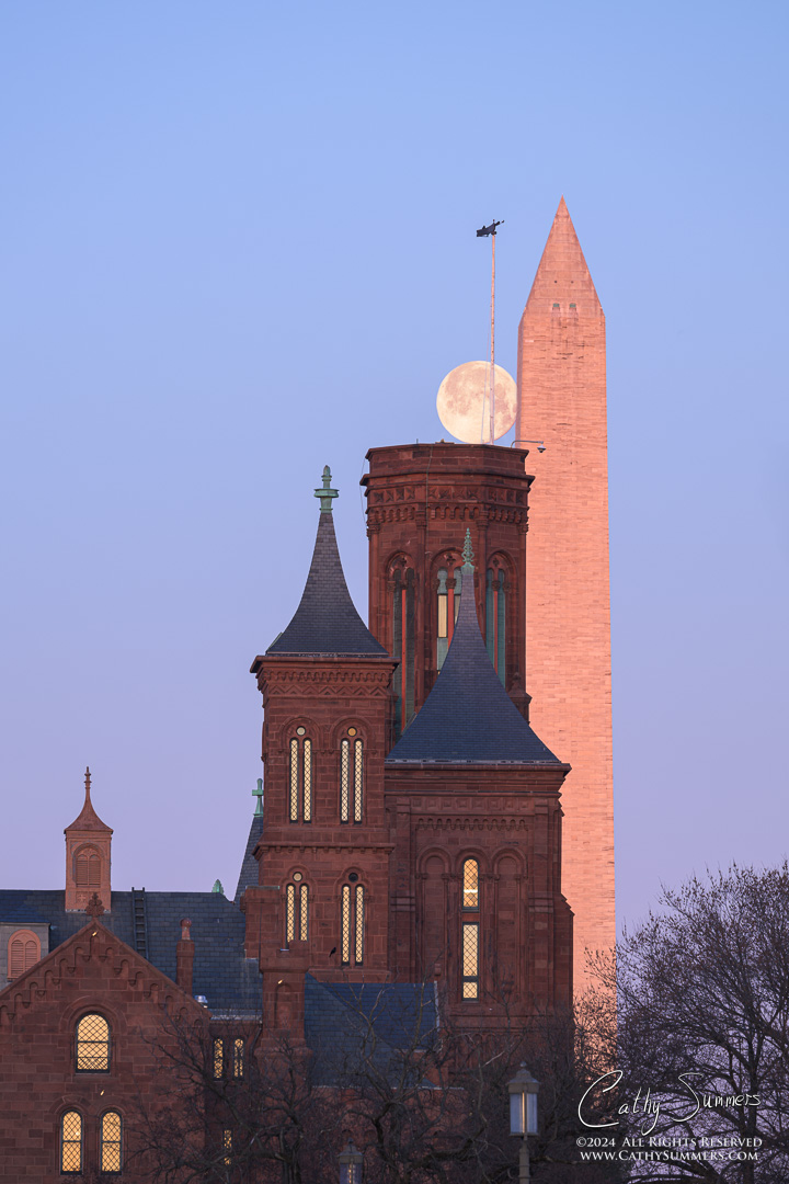 Full Moon Slipping Behind The Washington Monument and Smithsonian Castle